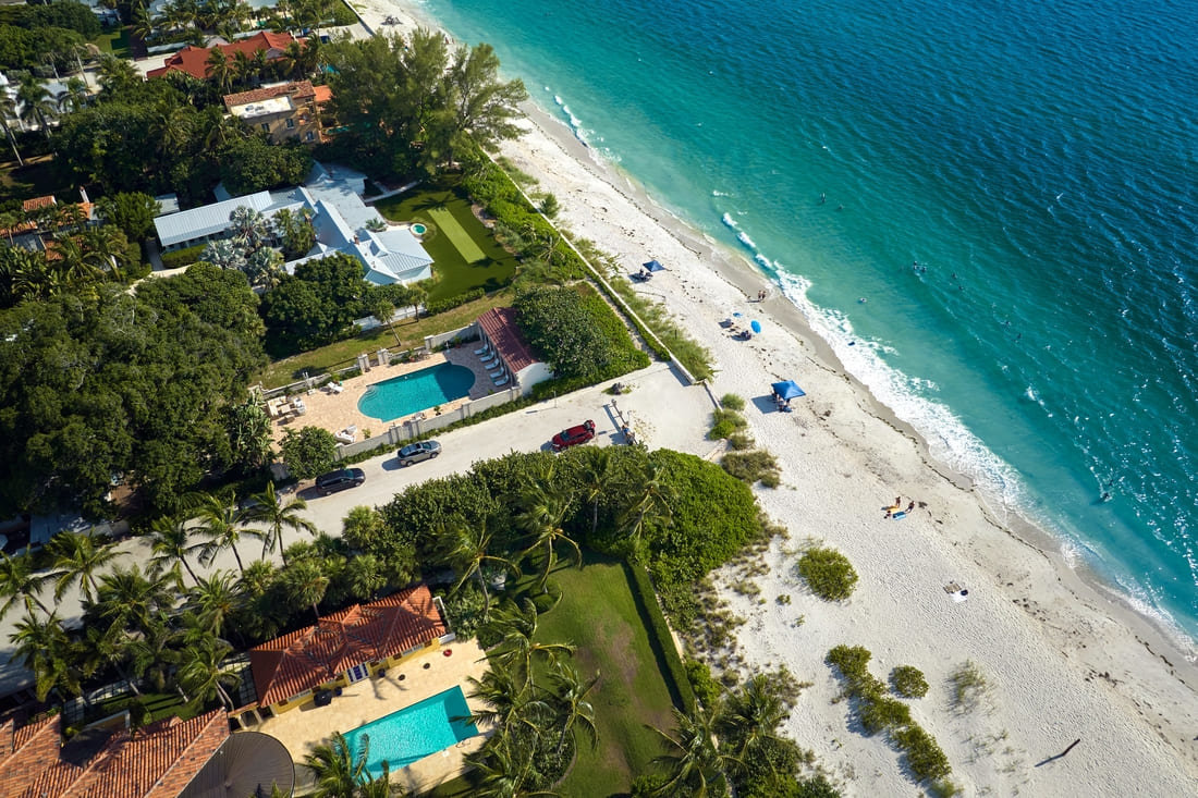 Aerial view of waterfront homes on a beach in Florida