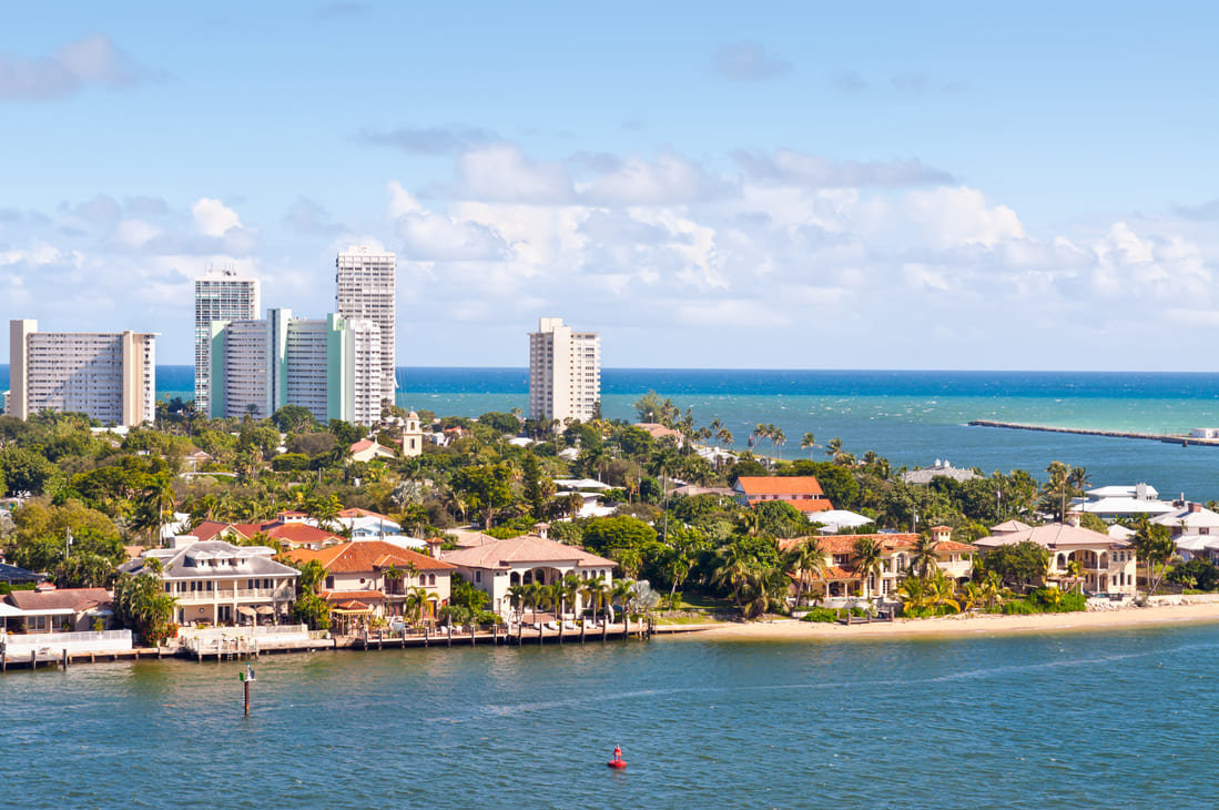 Waterfront real estate in Fort Lauderdale with city skyline in the background