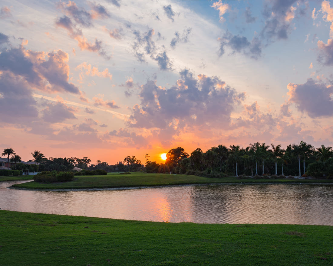 Sunset over a water feature on a golf course in Florida