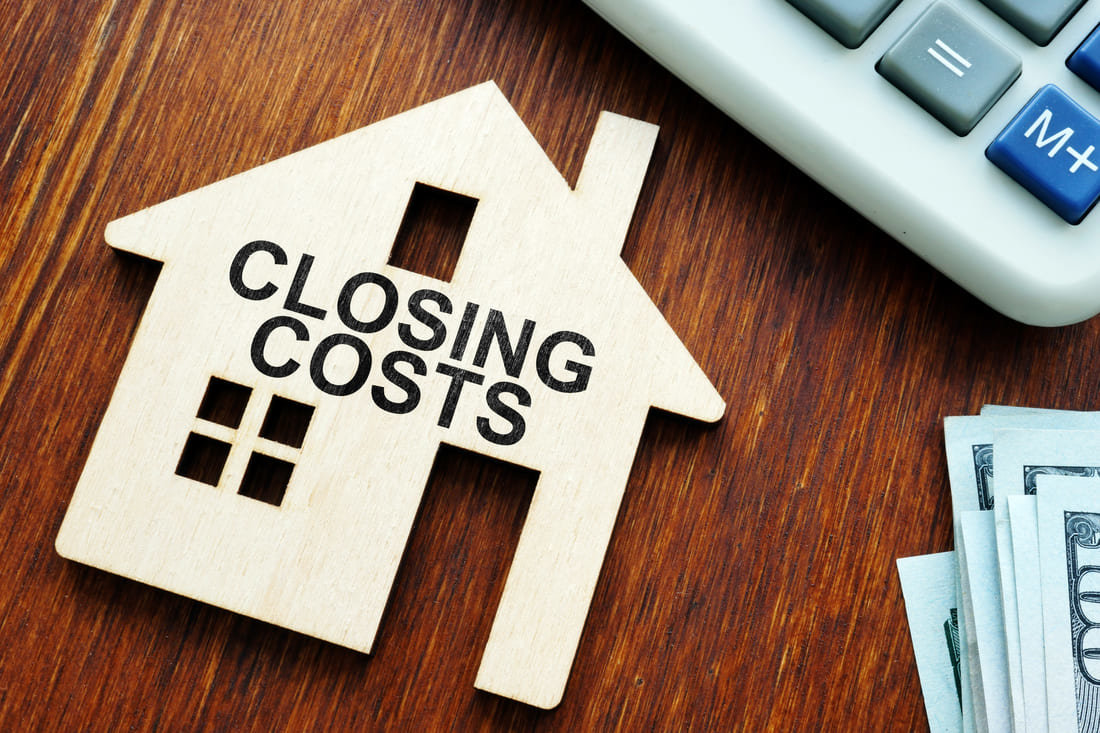 Silhouette of a home with closing costs written on the front