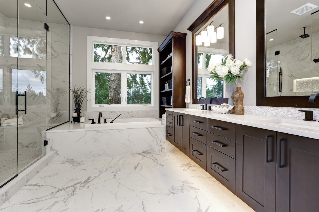 Beautiful remodeled bathroom with marble and white tiles