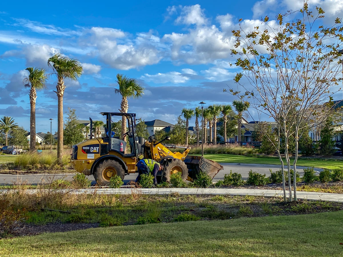 A Florida landscaping company remodeling a commercial building's landscaping.