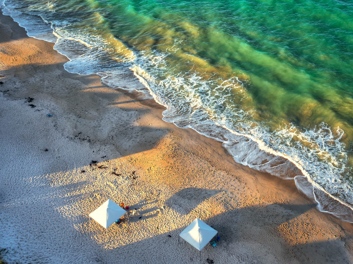 An aerial view of Vero Beach and two umbrellas 