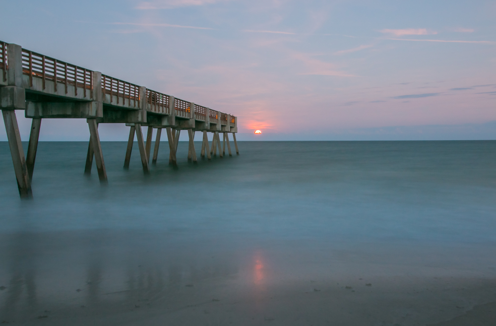 Pier over the ocean and sunset in Vero Beach, Florida