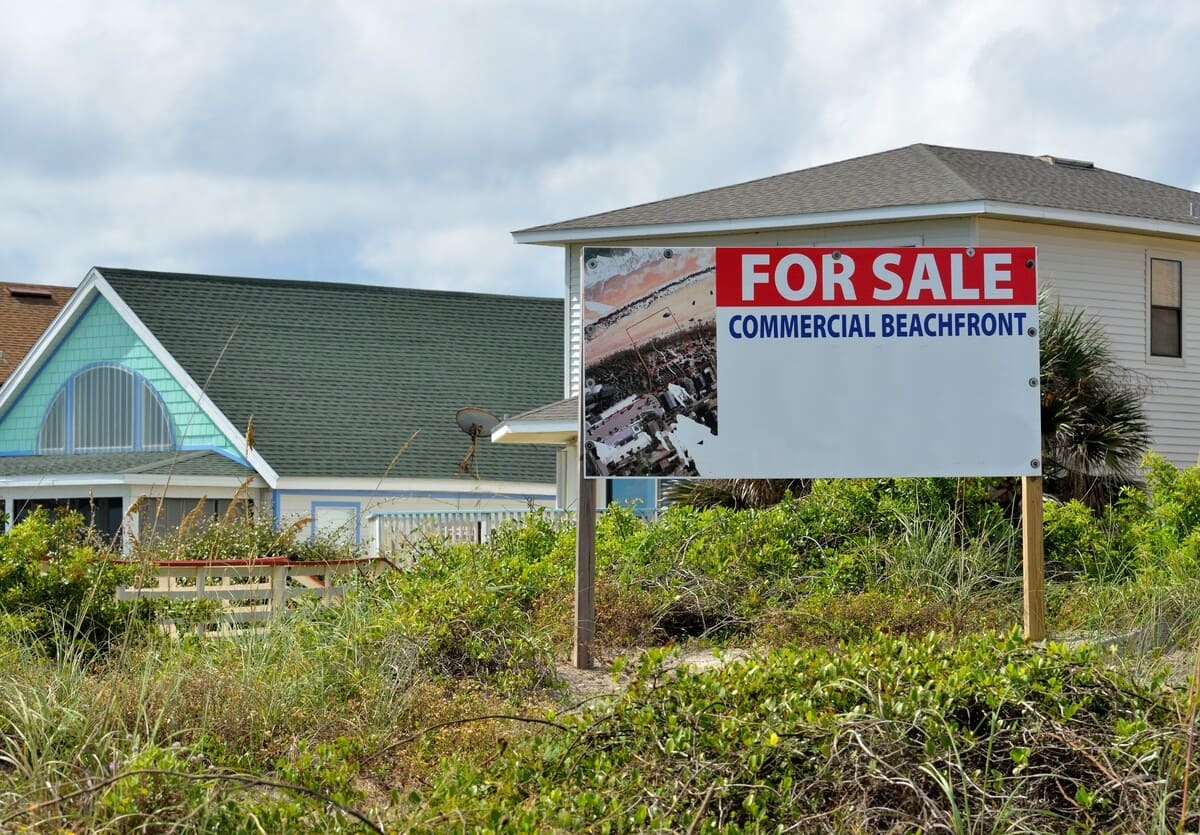 A for sale sign outside of a Floridian commercial property.